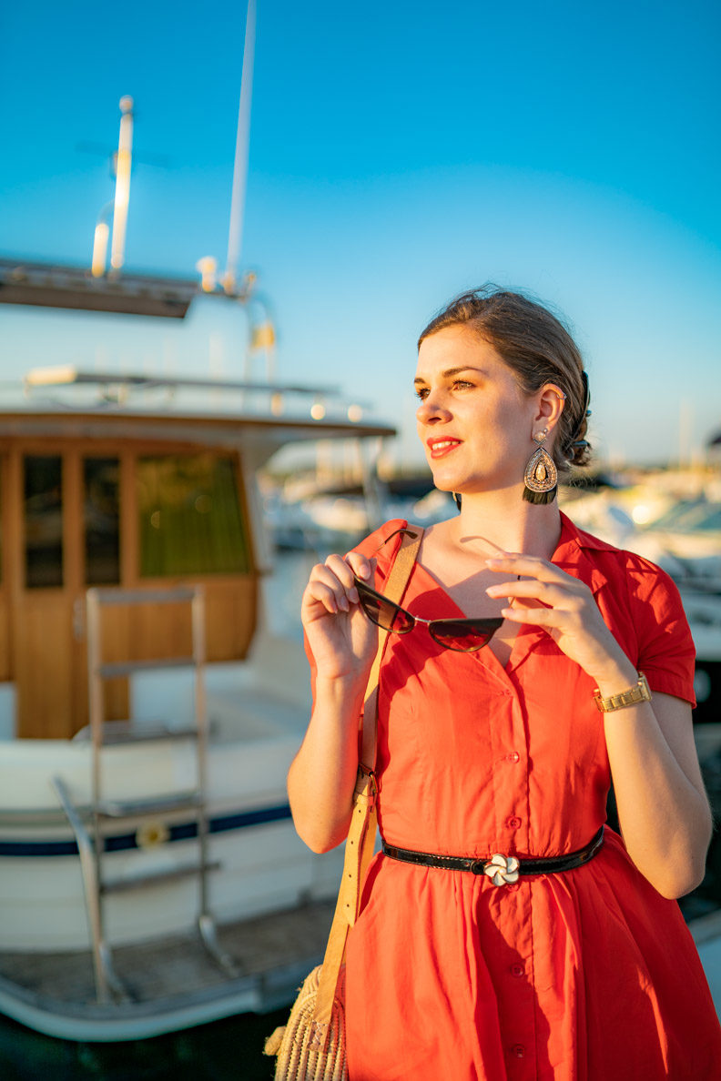 RetroCat with a coral-coloured dress and retro sunglasses