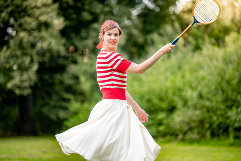 RetroCat wearing a chic 1930s inspired sport outfit for summer