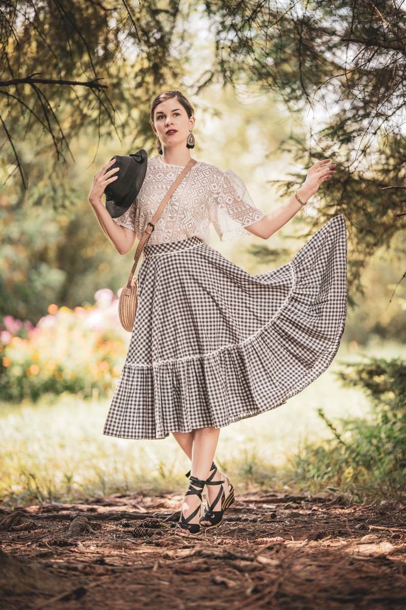 RetroCat with a vichy check skirt by Lena Hoschek and a romantic blouse in the woods