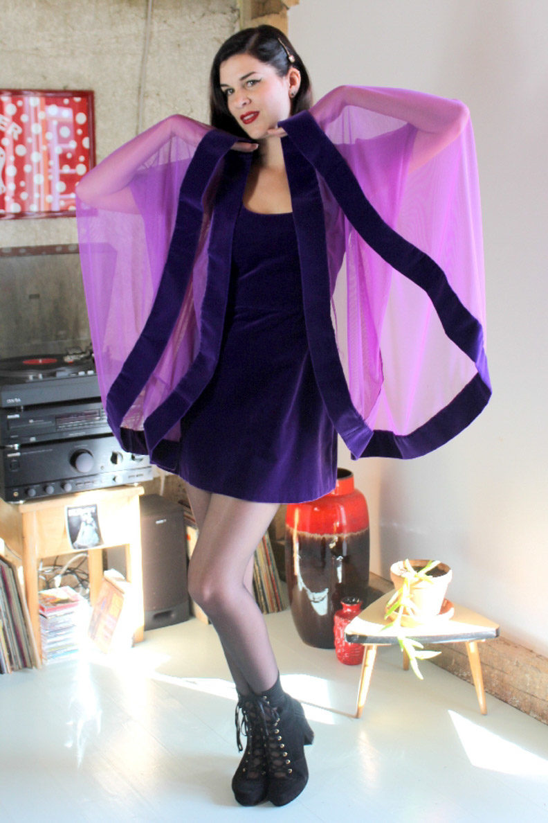 RetroCat wearing a purple mini dress made of soft velvet by Grünten Mode