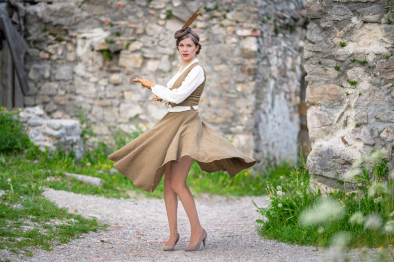 RetroCat with beige fishnet tights and a classy retro outfit for the countryside