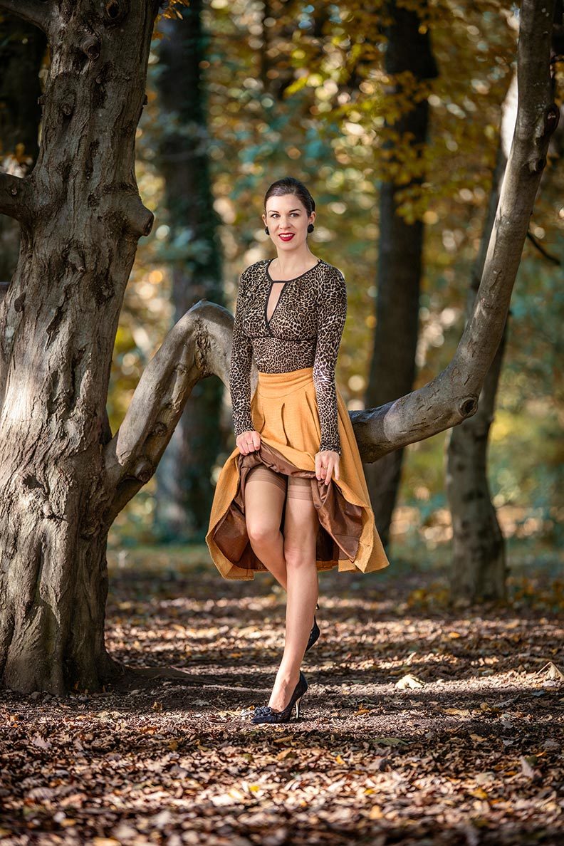 RetroCat wearing a top with leopard print, a matching skirt and nylons by Secrets in Lace