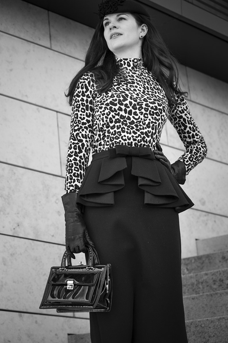 RetroCat wearing a leopard turtleneck and a retro pencil skirt