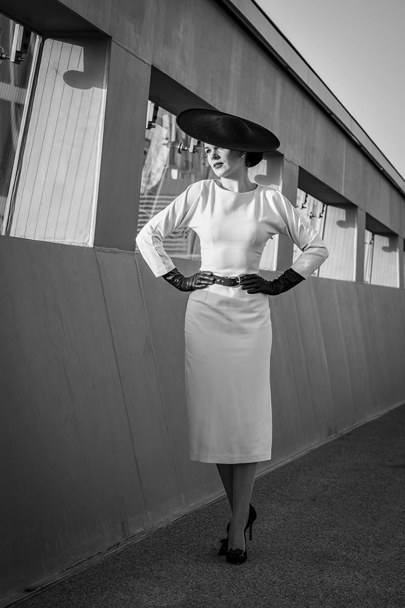 RetroCat wearing a white pencil dress by Ginger Jackie and matching retro accessories