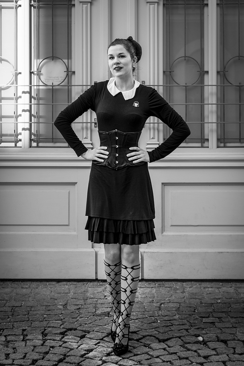 RetroCat wearing a little black dress, a corset by Agent Provocateur and fancy tights
