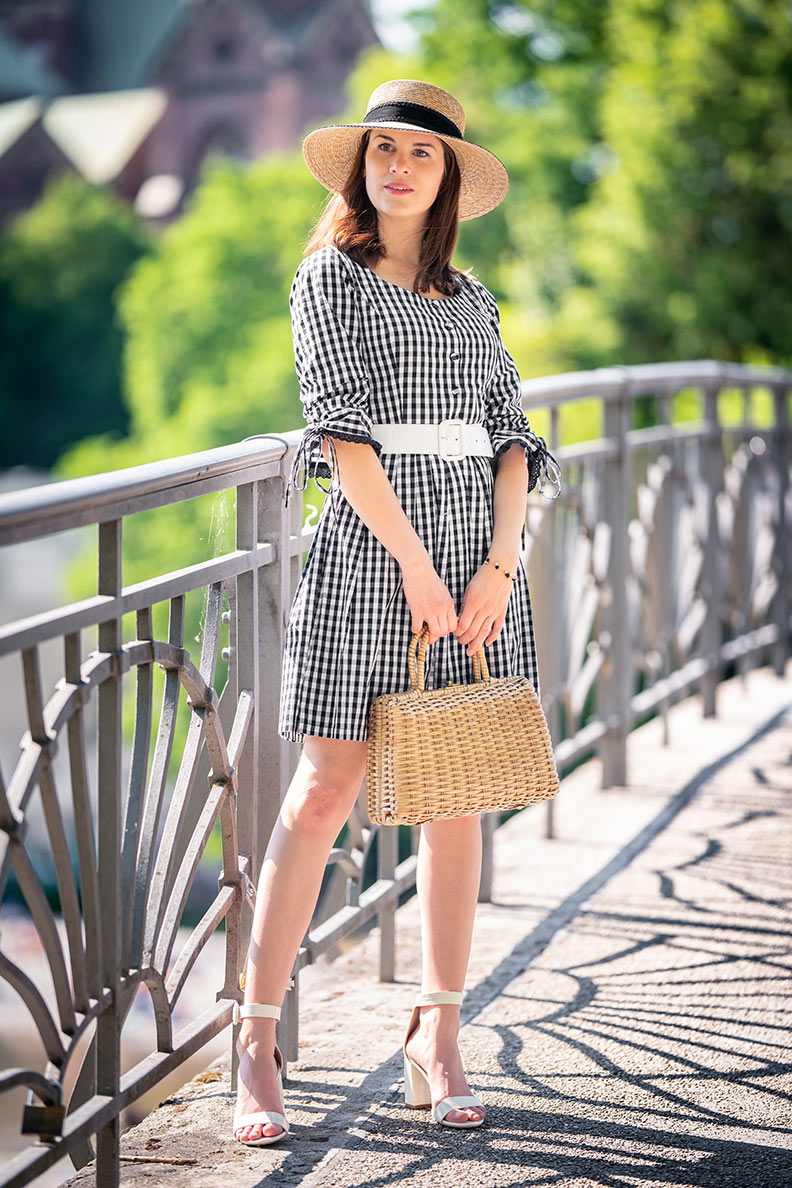 RetroCat wearing white sandals and a gingham summer dress