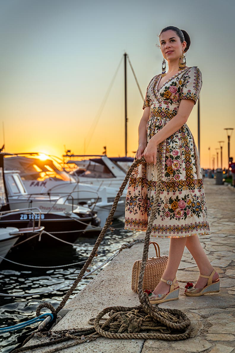 RetroCat wearing a romantic summer dress by Lena Hoschek with a flower pattern