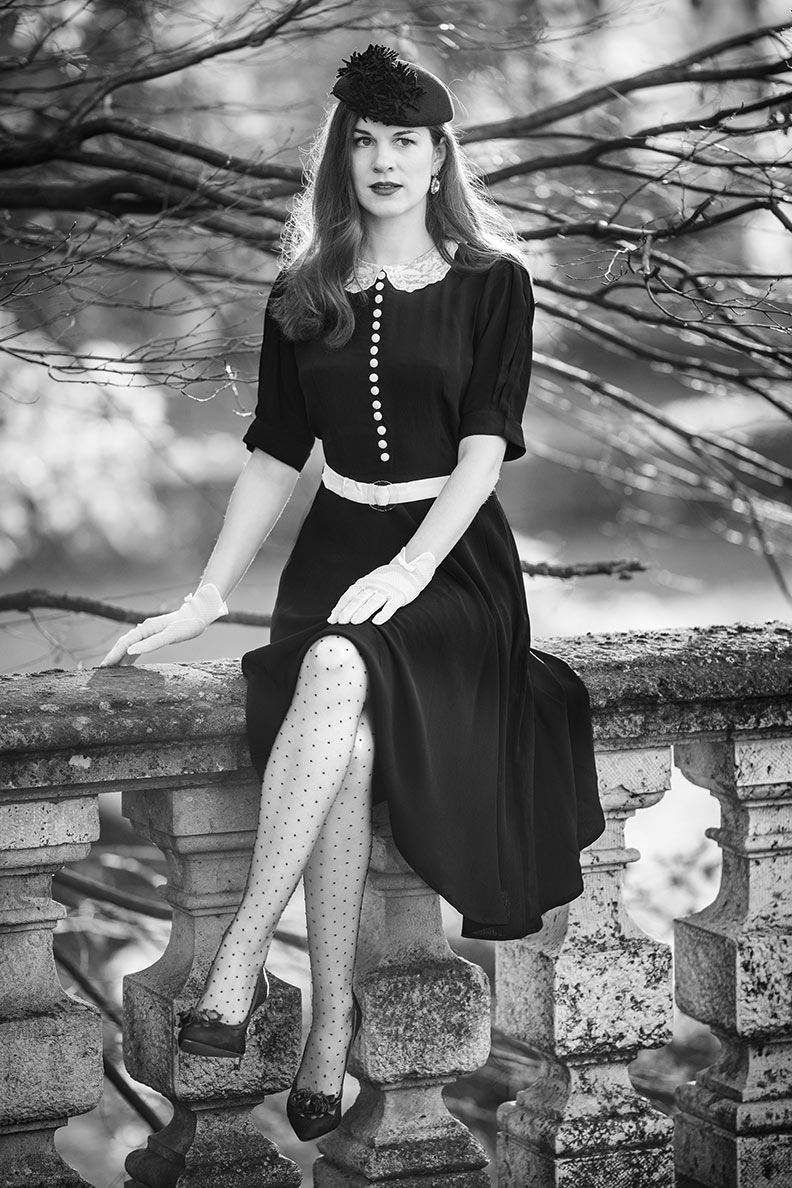 RetroCat wearing dotted tights with her black retro dress