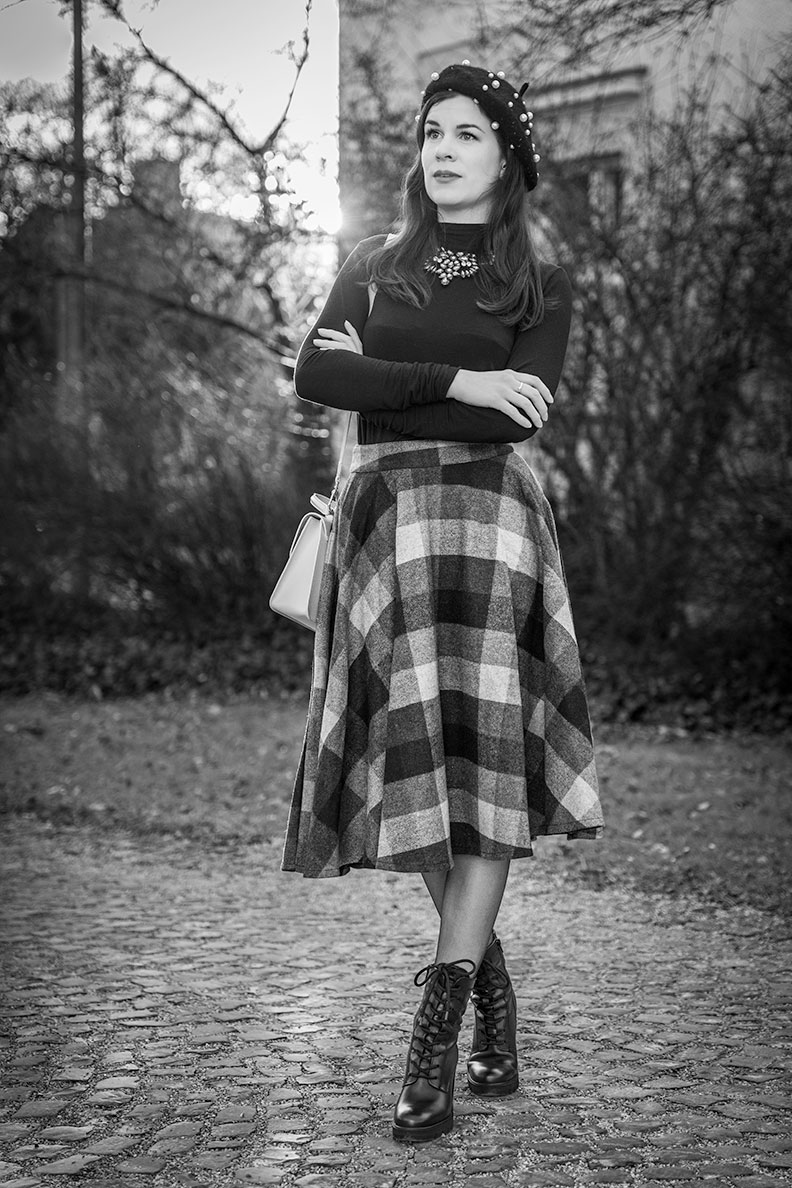 RetroCat wearing a plaid winter skirt by Timeless London and subtle accessories