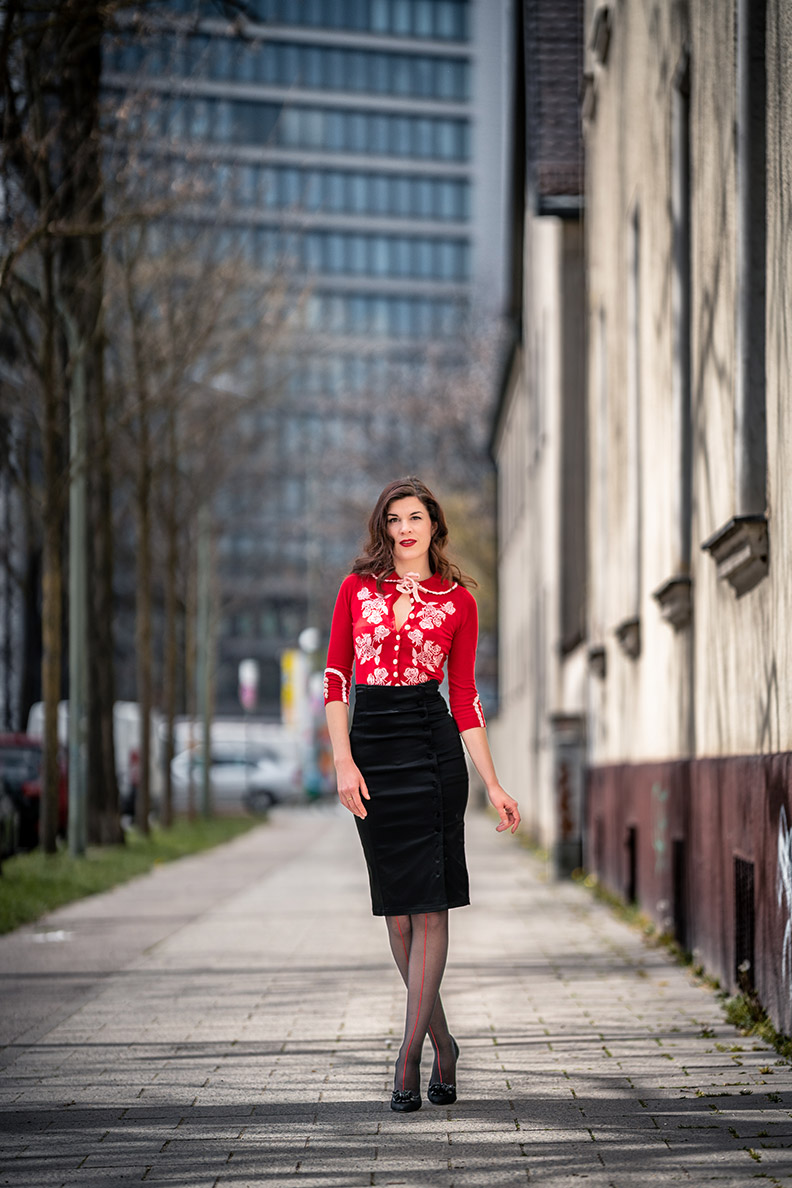 RetroCat wearing a cardigan and pencil skirt in spring