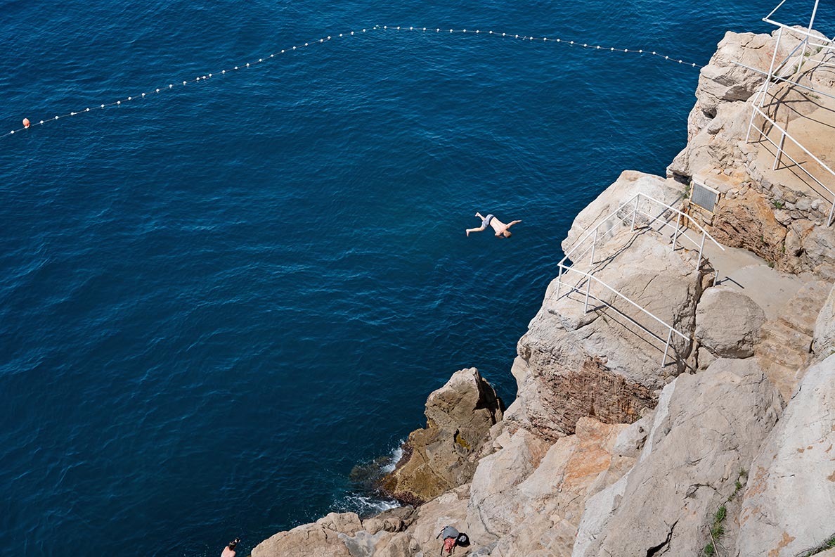 A jump into the Adriatic sea from the cliffs in Dubrovnik