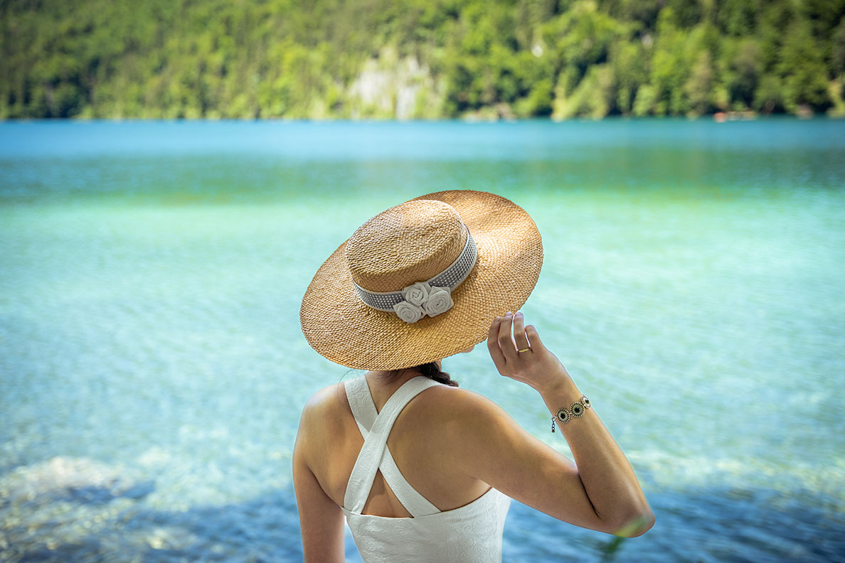 RetroCat wearing an elegant retro straw hat at the lake