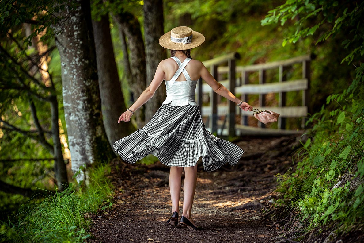 RetroCat wearing a gingham circle skirt by Lena Hoschek and a matching hat