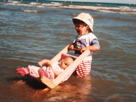 RetroCat as a child with her stroller in the sea
