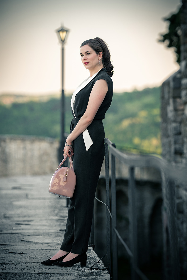 French chic: RetroCat wearing an elegant black Jumpsuit