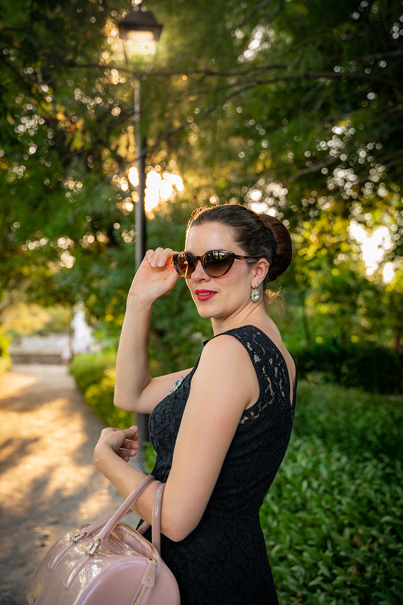 RetroCat wearing retro sunglasses with her dress made of black lace