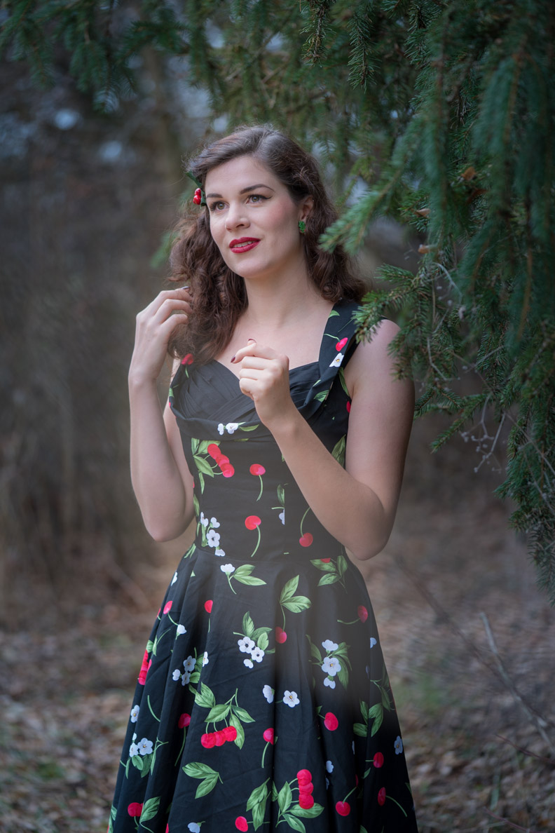 RetroCat wearing a black dress with cherry pattern