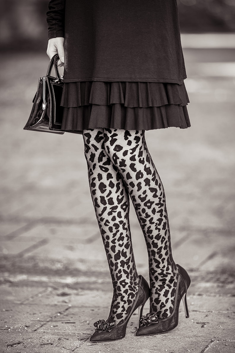 RetroCat in tights with a fashionable leopard pattern