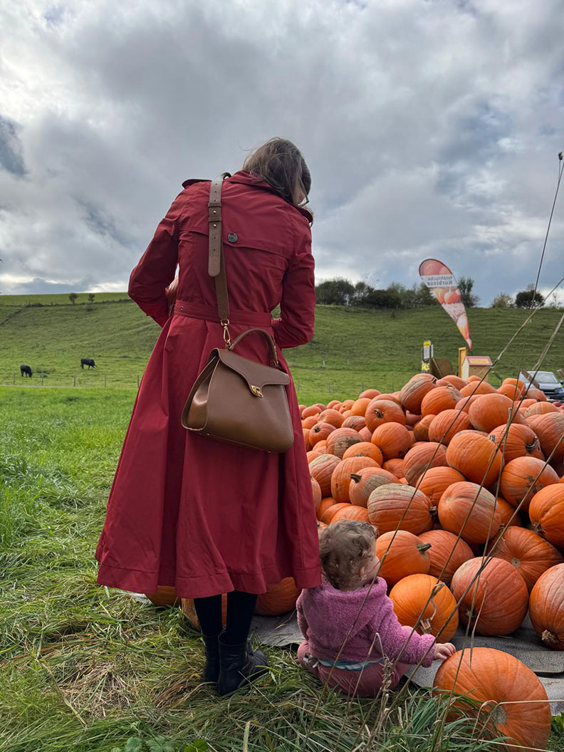 RetroCat with her child in the pumpkin field