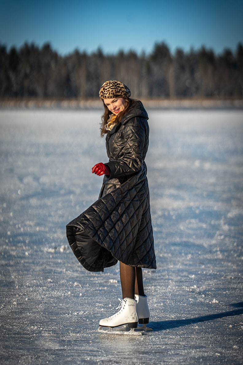 RetroCat with a retro quilted coat while ice skating