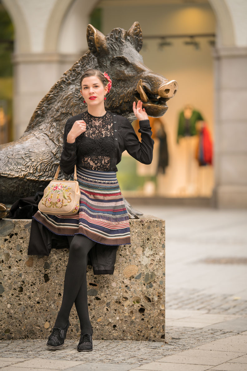 RetroCat with a vintage gobelin bag to match Lena Hoschek's traditional skirt