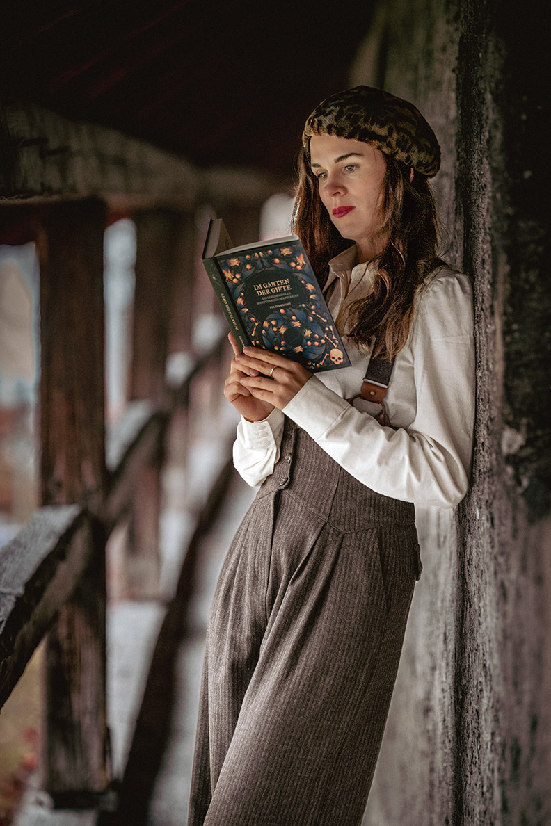 RetroCat in a Dark Academia outfit while reading