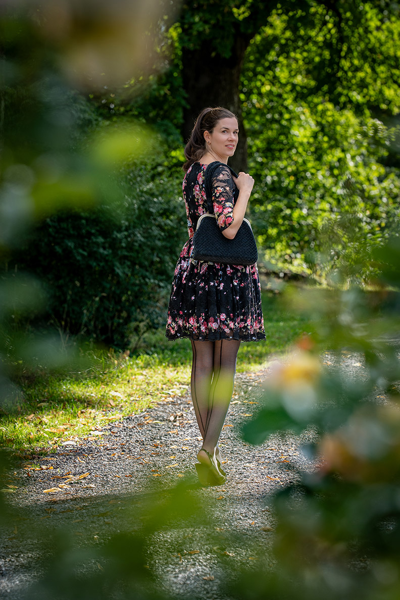 RetroCat with dark nylon tights and a rose dress