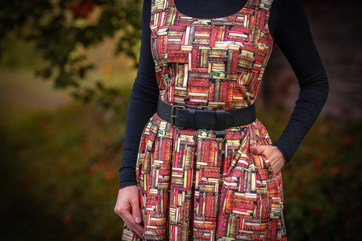 RetroCat is wearing a dress by Dolly and Dotty with a book print.